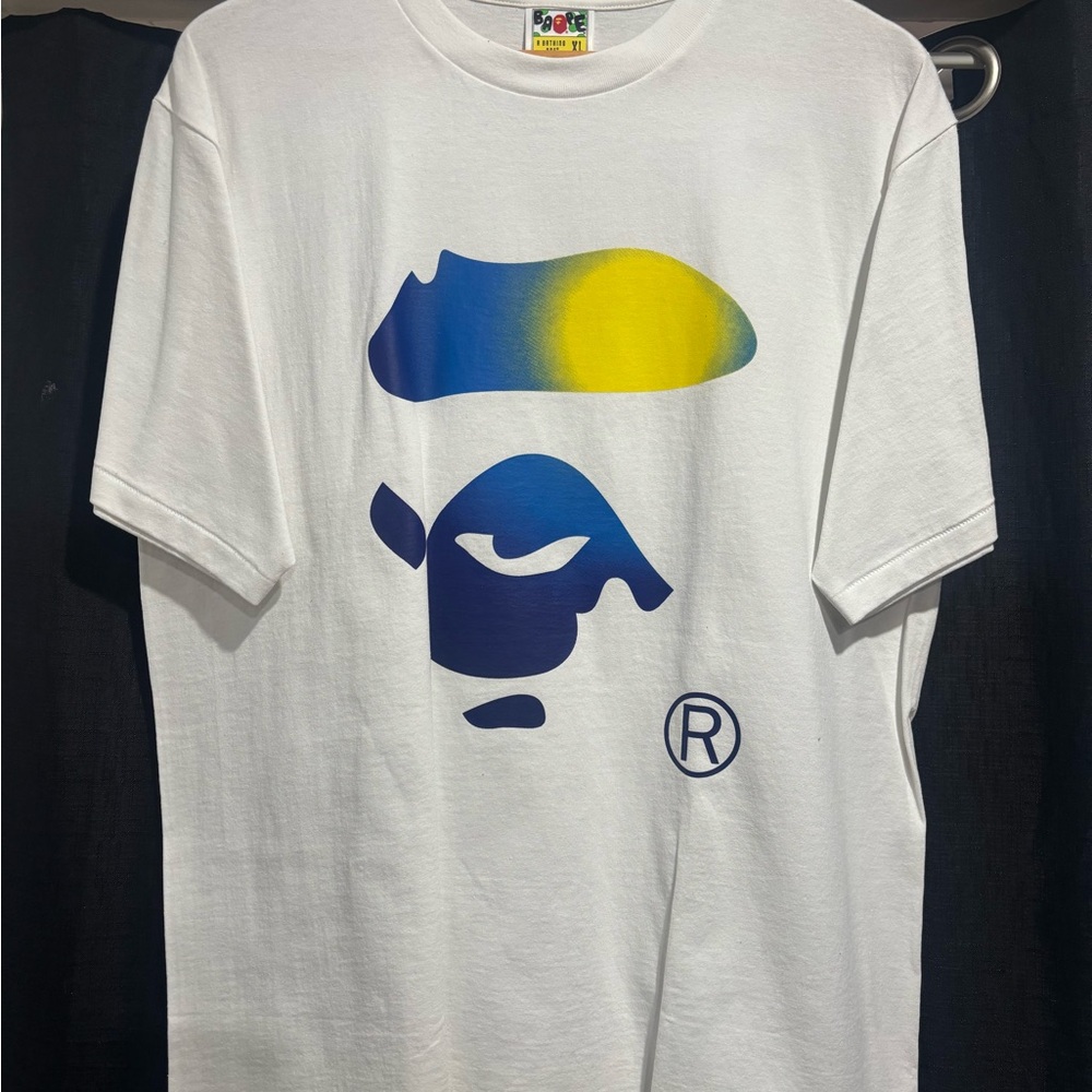 White Graphic Tee with Blue and Yellow Design